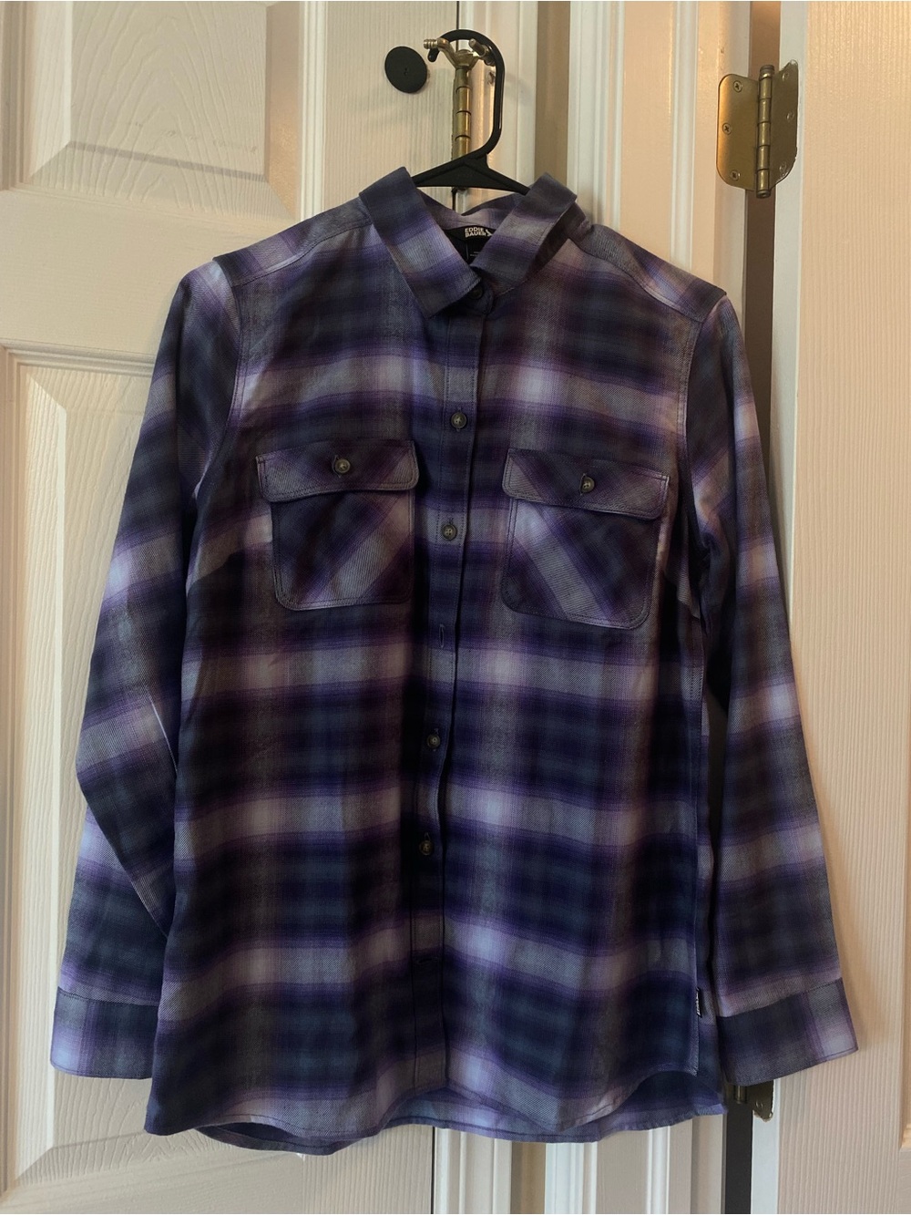 Cozy long sleeve plaid shirt by Eddie Bauer in deep purple tones.